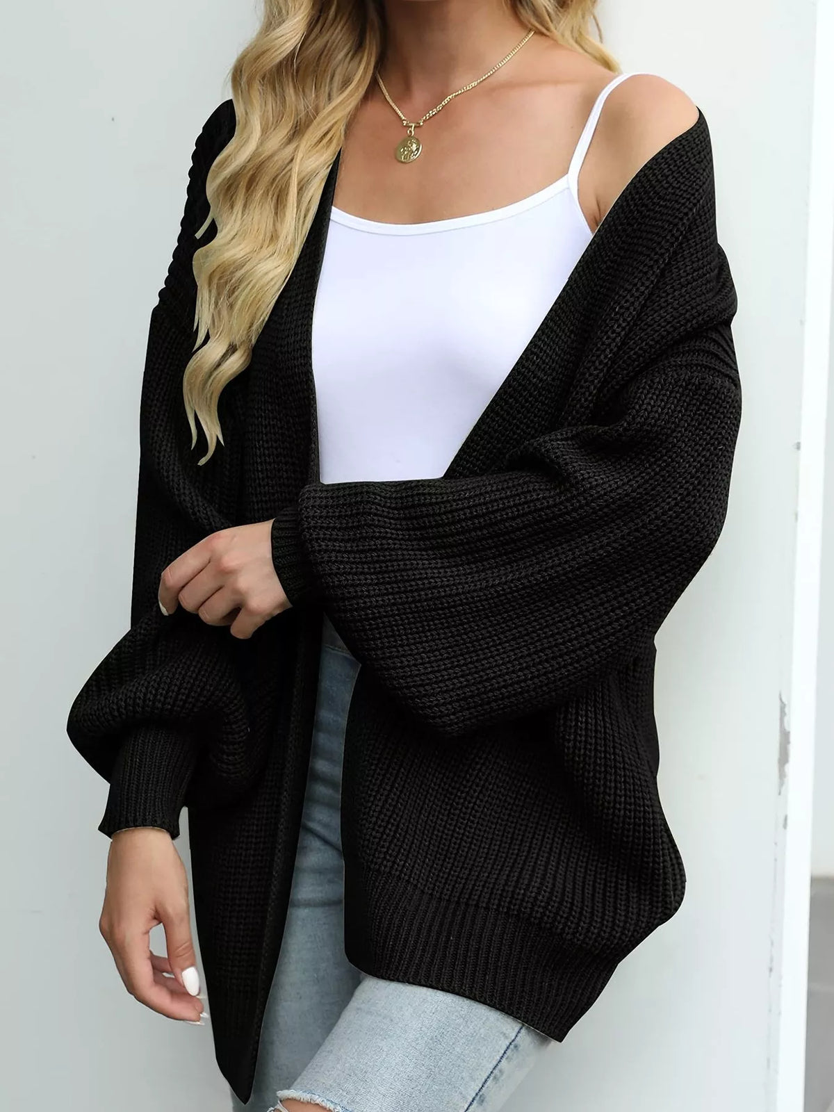Black chunky knit cardigan with open front and lantern sleeves