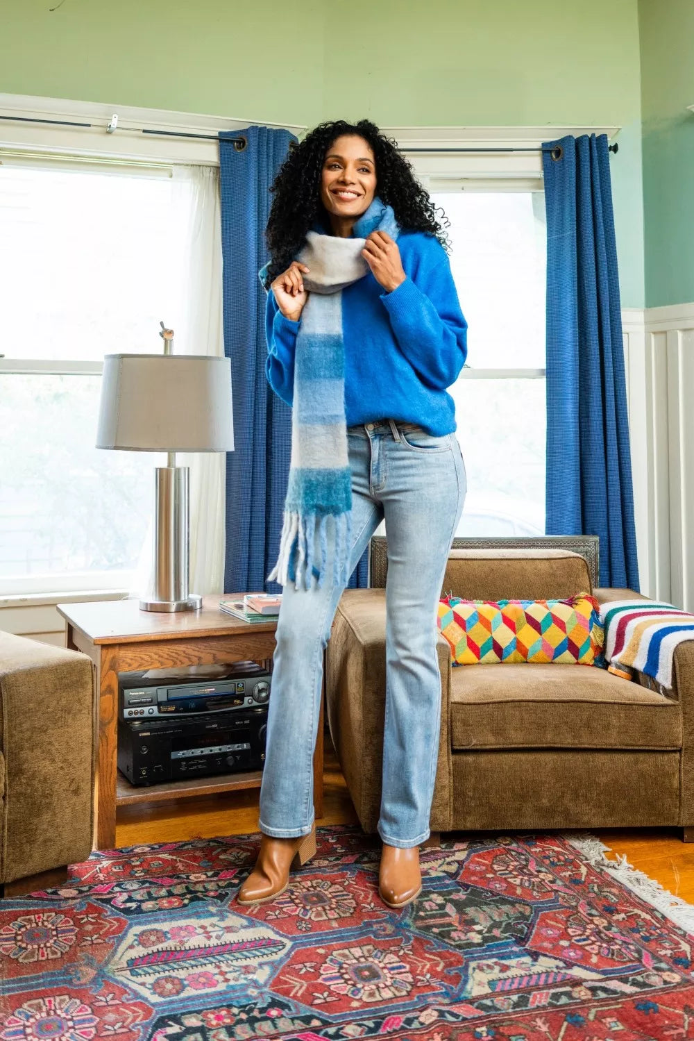 Mid-rise thermal bootcut jeans in light wash denim with soft fringe cuffs