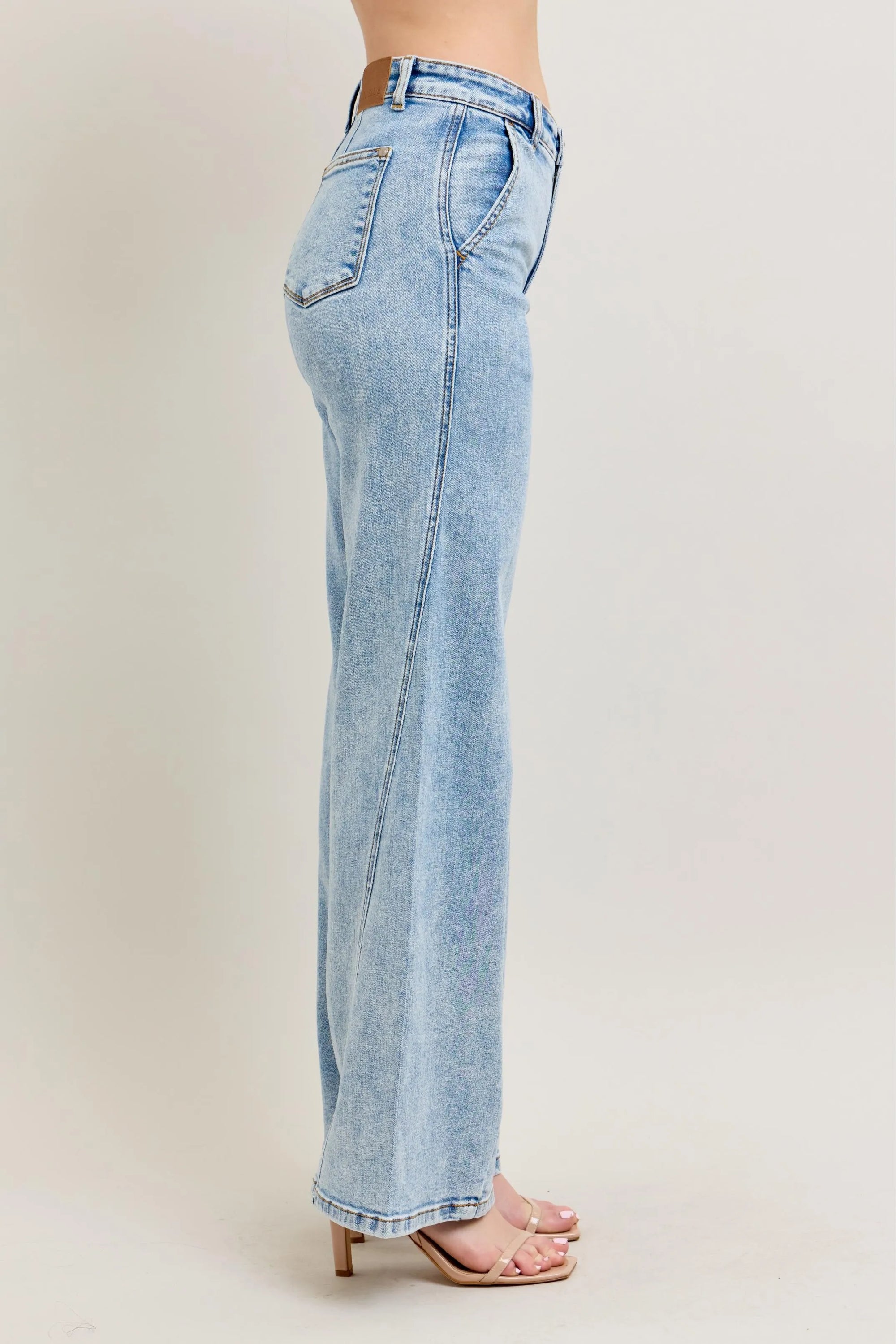 Plus size high-waist wide-leg jeans, light wash denim, back side view