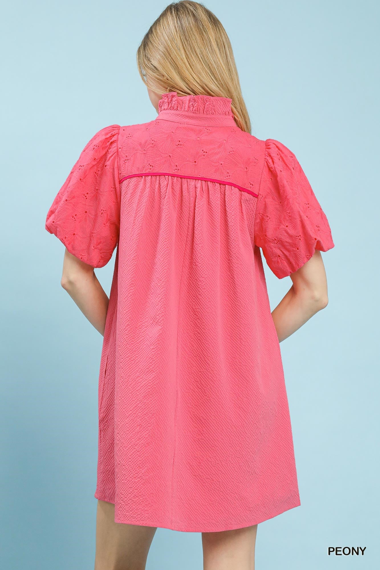 Pink textured eyelet babydoll mini dress with puff sleeves and back yoke