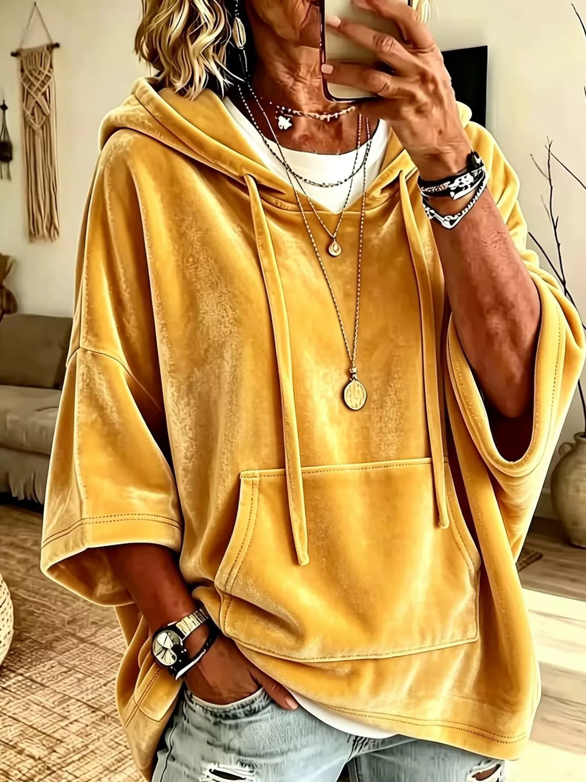 Yellow velvet kangaroo pocket hoodie with hood, front pouch pocket, and drawstrings.