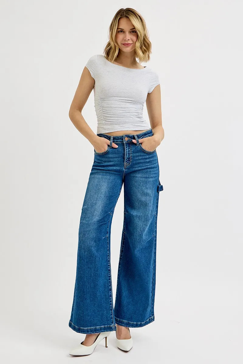 High-rise wide-leg jeans in blue denim with side patch detail and front button closure