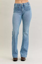 Light blue mid-rise bootcut jeans with front patch pockets and contrast wash