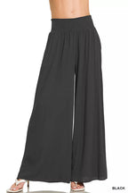 Black wide-leg lounge pants with smocked waistband