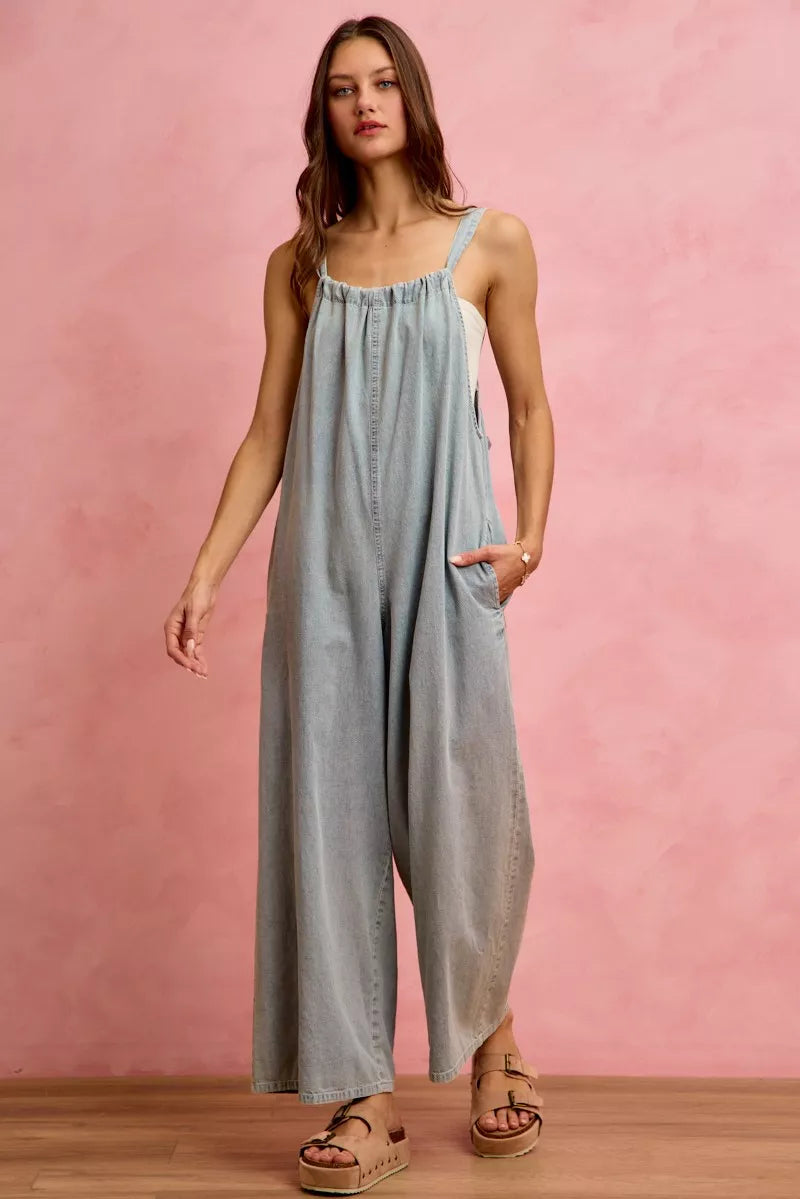 Light blue denim wide-leg overalls with square neckline and side pocket detail