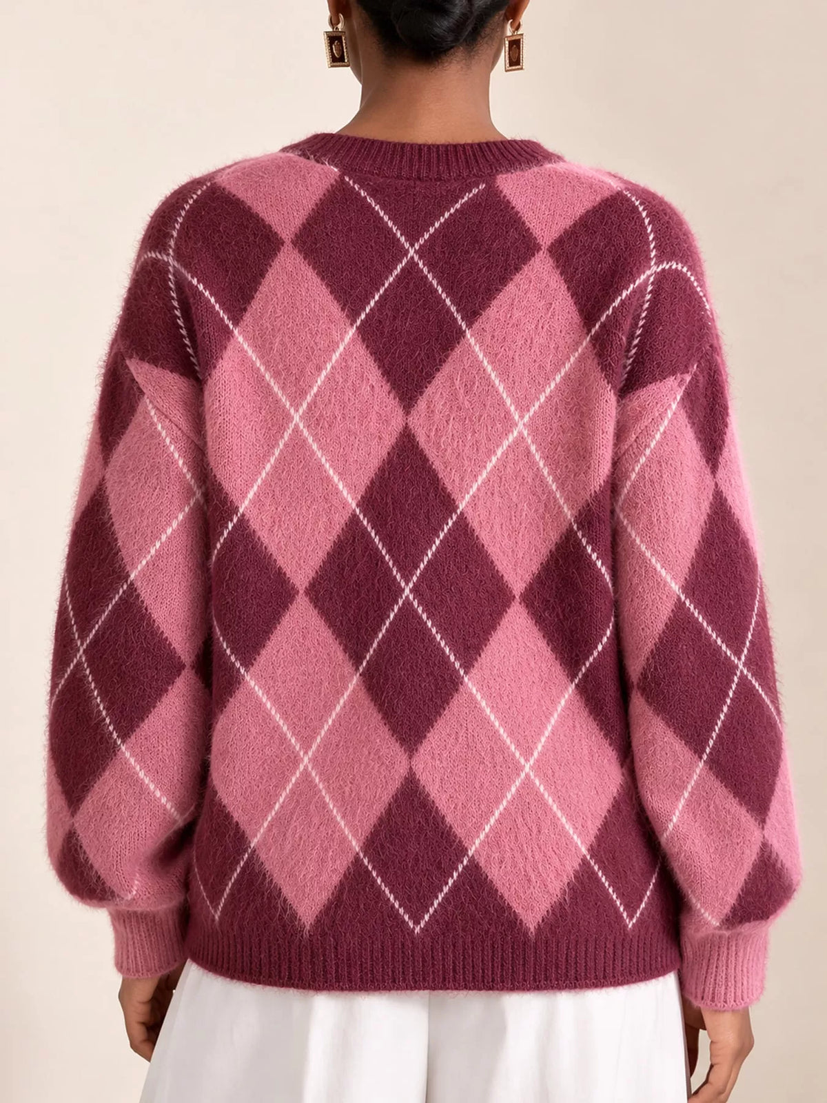Fuzzy argyle knit sweater with mauve pink base, white diamond argyle on the back