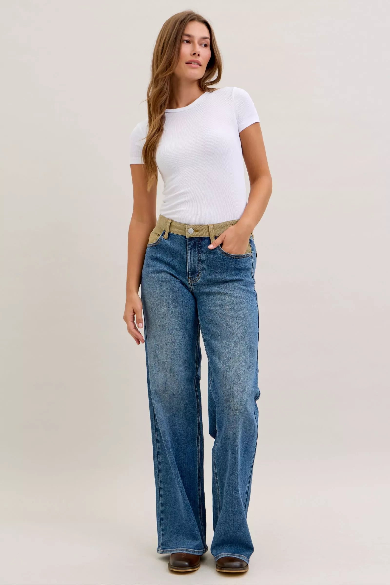 Women’s mid-rise straight jeans in blue stretch denim with tan corduroy waistband