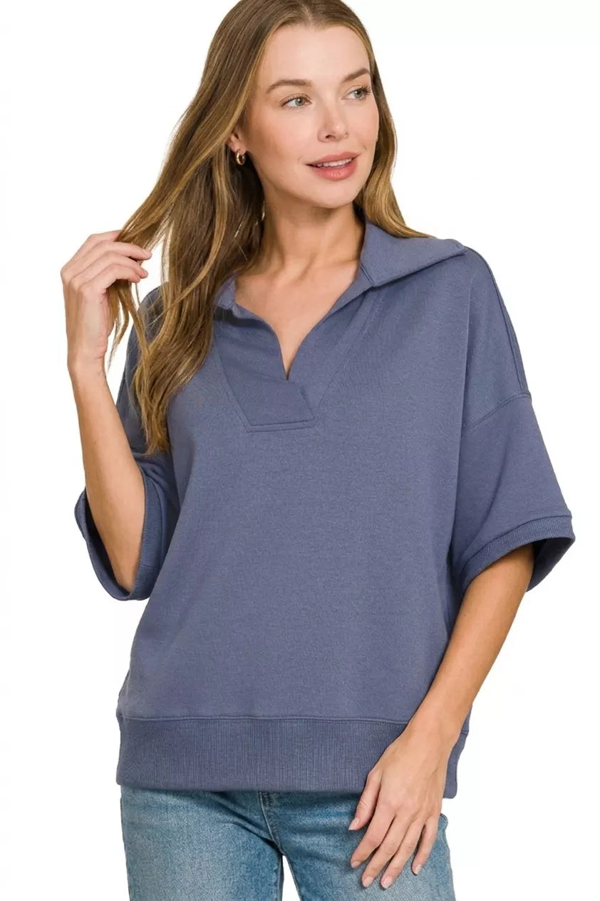 Blue indigo polo collar short-sleeve pullover, side-slit hem and soft knit texture