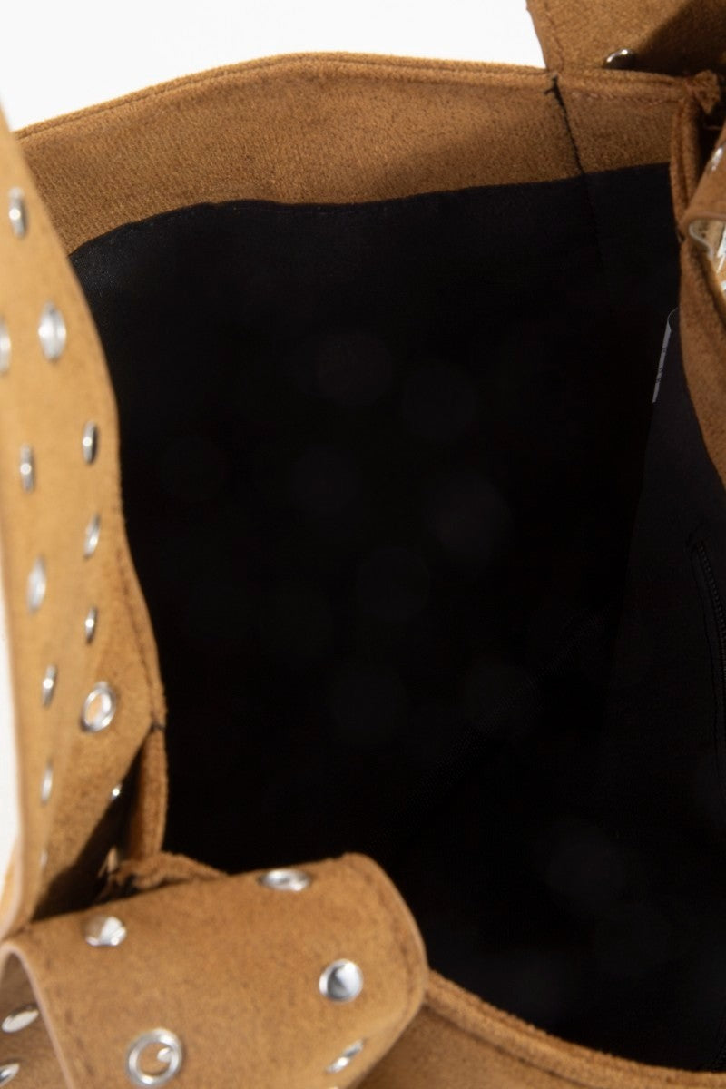 Suede shoulder bag interior, brown exterior with black lining and silver grommet details