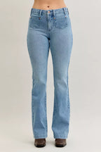 Light blue mid-rise bootcut jeans with button closure and front patch pockets