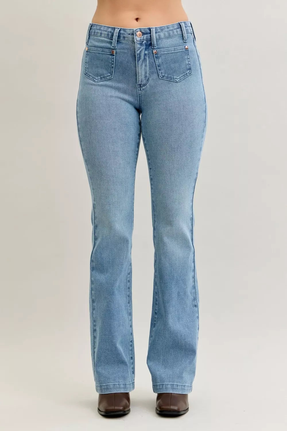Light blue mid-rise bootcut jeans with button closure and front patch pockets