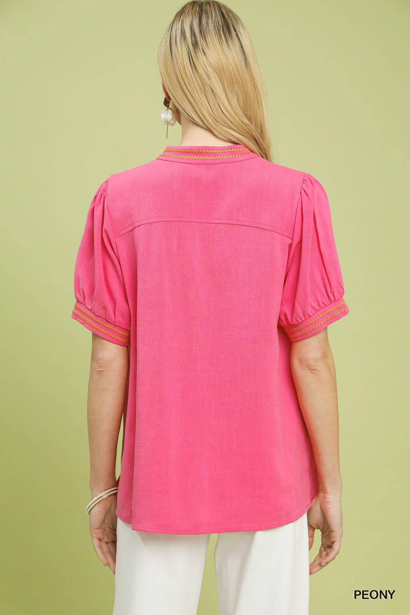 Embroidered linen puff-sleeve blouse back view, peony pink with short sleeves