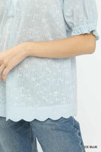 Ice blue pintuck blouse sleeve with gathered cuff detail and scalloped hem