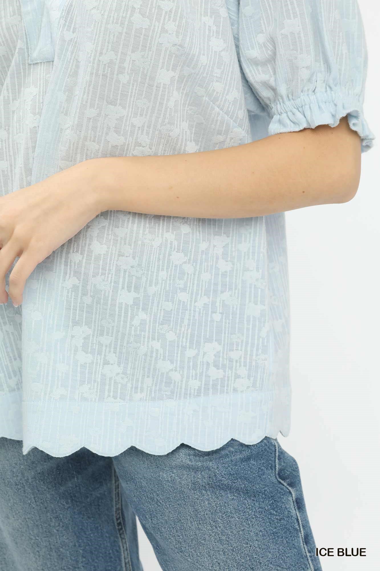 Ice blue pintuck blouse sleeve with gathered cuff detail and scalloped hem