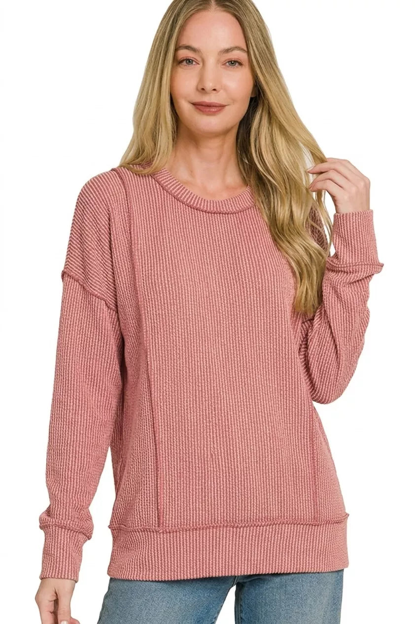 Dusty rose corded rib long sleeve top with crew neck and ribbed hem