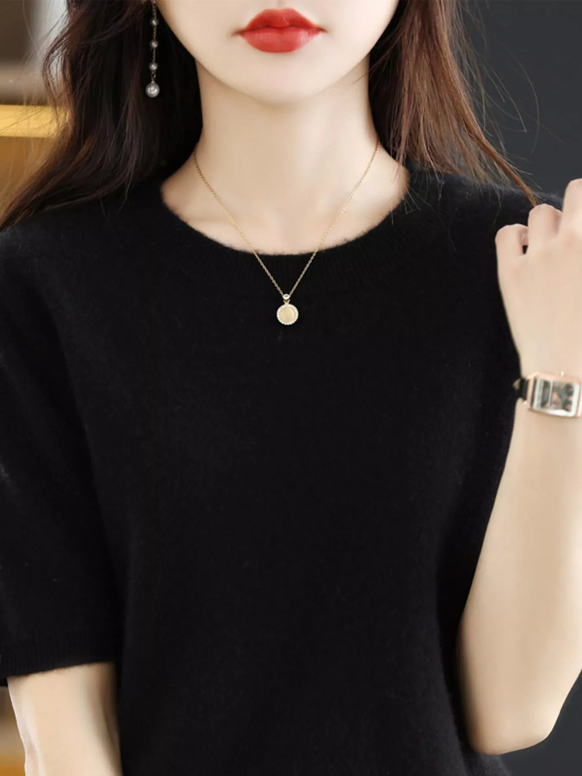 Black short-sleeve round-neck knit sweater with ribbed neckline and hem