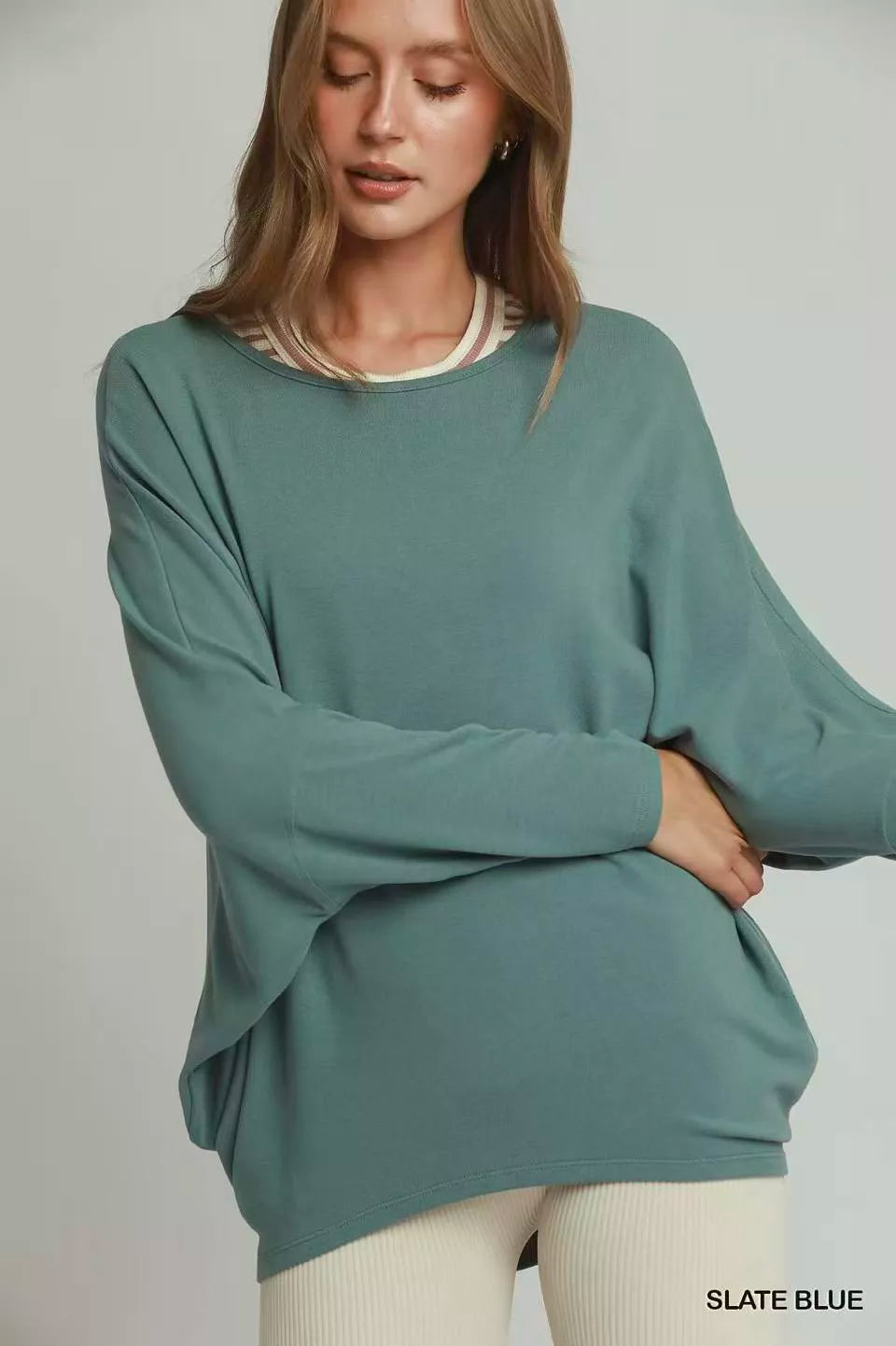 Slate blue batwing long-sleeve round-neck top with ribbed trim at collar and hem