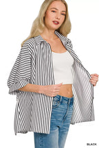 Women's oversized striped button-down shirt with open collar, short sleeves, black-and-white stripes