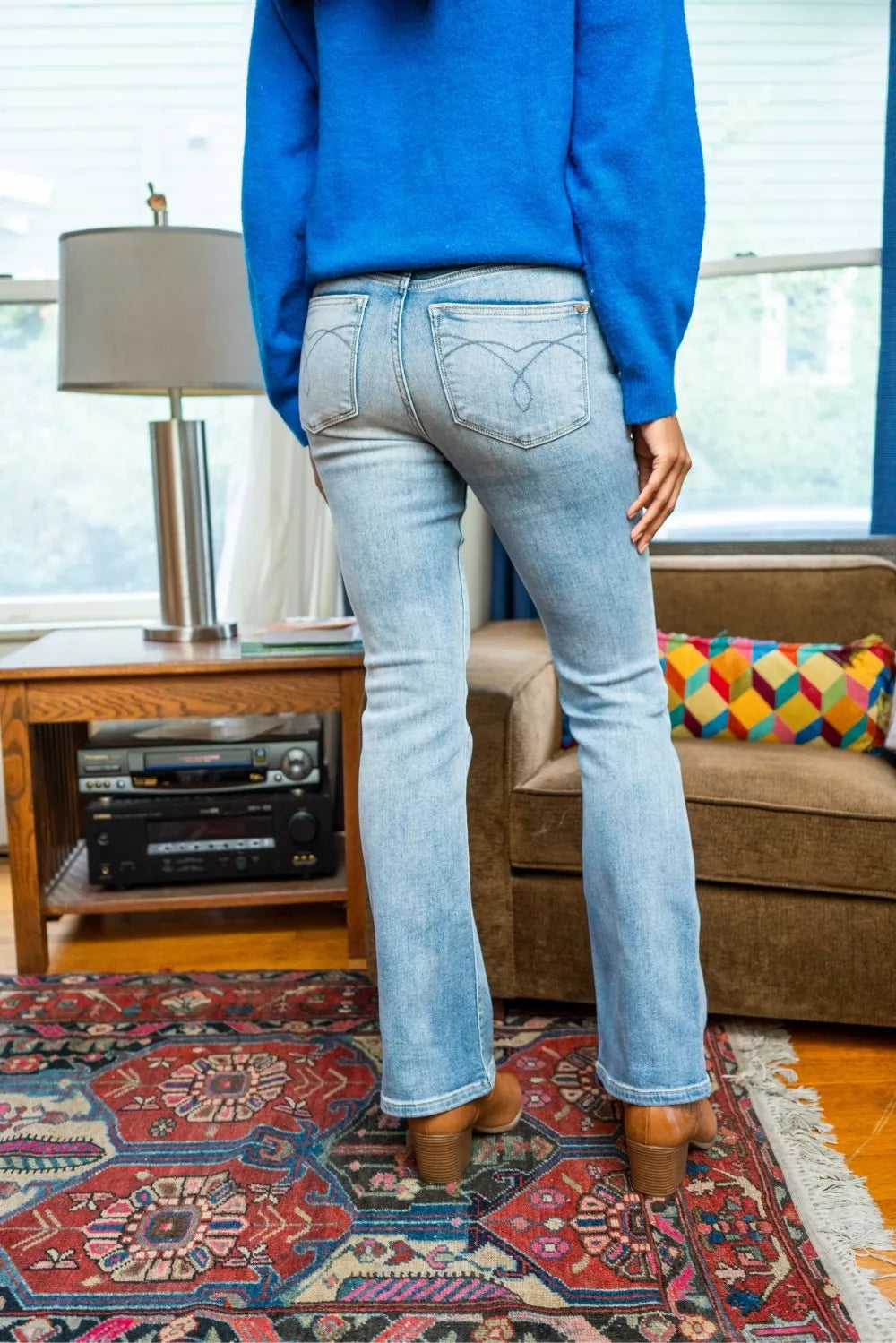 Thermal bootcut jeans in light wash with mid-rise waist and back yoke stitching