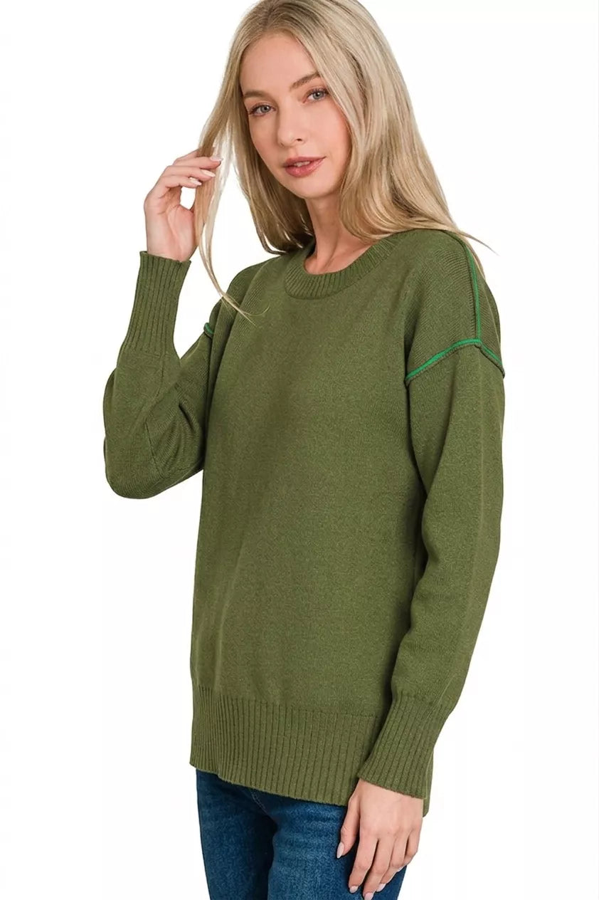 Olive knit top with round crew neck and contrast green trim along sleeves