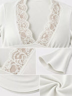 White lace-trim V-neck long sleeve tee close-up with scalloped lace edges and bell cuffs.