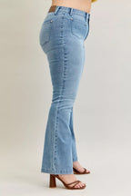 Light blue mid-rise bootcut jeans side view with visible belt loops and seam detailing