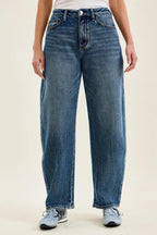 Petite wide-leg indigo wash jeans with button-and-zip front and belt loops