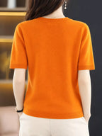 Back view of a bright orange round-neck short-sleeve sweater