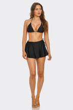Black triangle bikini top and high-rise swim skirt with side tie and ruffle hem