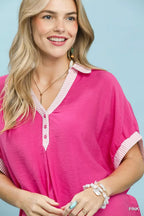 Pink V-neck button top with contrast stripe collar and sleeve edge trim