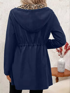 Navy hooded drawstring waist jacket with long sleeves, back view on mannequin