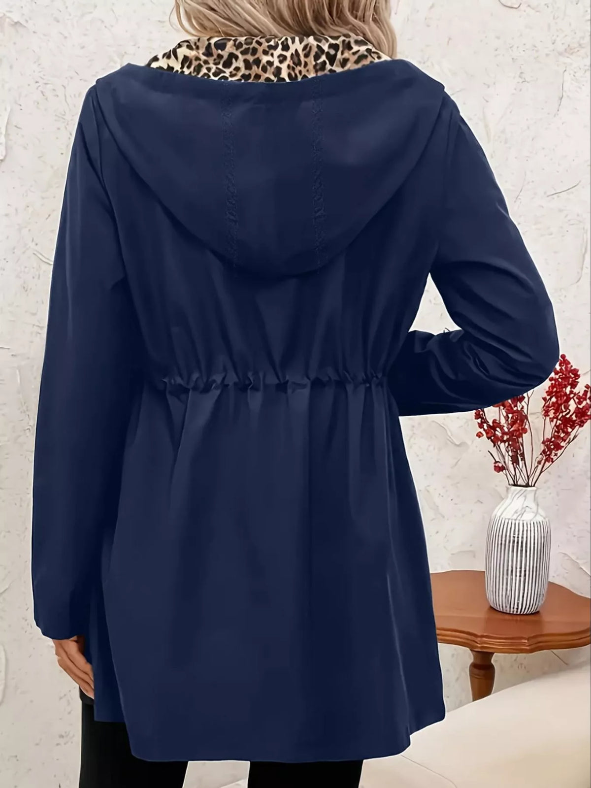 Navy hooded drawstring waist jacket with long sleeves, back view on mannequin