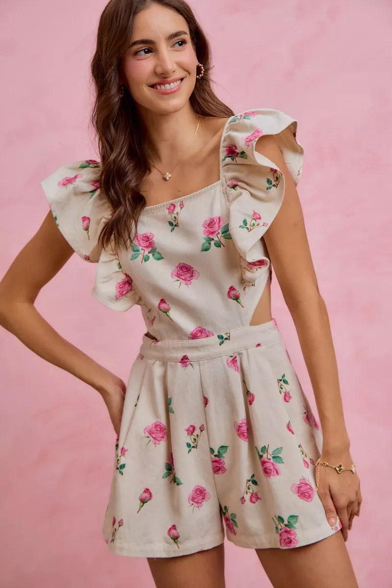 Ivory floral print denim romper with ruffled sleeves, square neckline, and belted waist