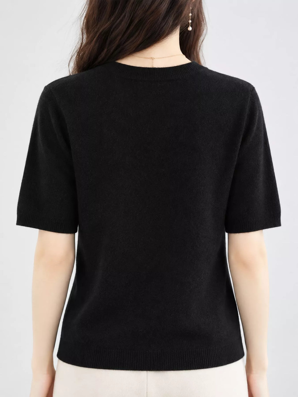 Black round-neck short-sleeve sweater, back view with ribbed trim