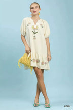 Ecru embroidered floral babydoll dress with short puff sleeves and tiered skirt
