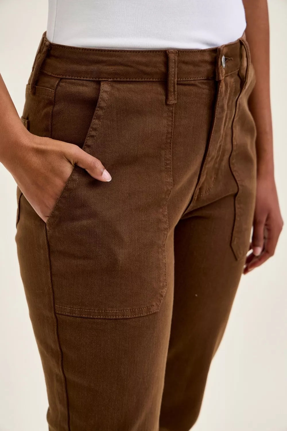 Mahogany wash jeans front close-up with stitched seams and patch pockets