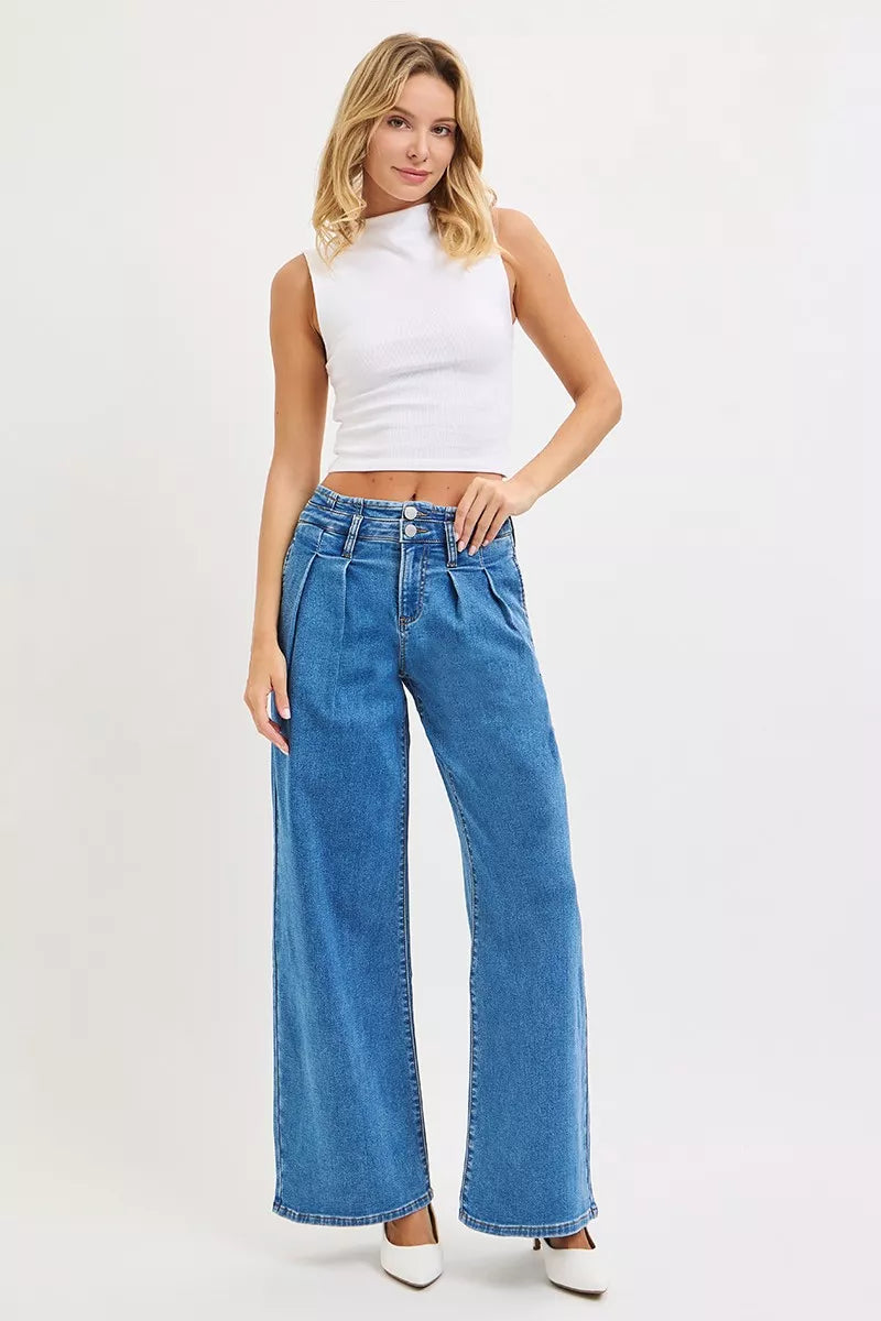 Medium-wash wide-leg pleated jeans with mid rise and button front