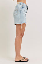 Light wash denim high-waisted shorts with frayed hem, side distress, back pocket
