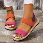 Women’s open-toe flat sandals with orange and hot pink knit cross straps