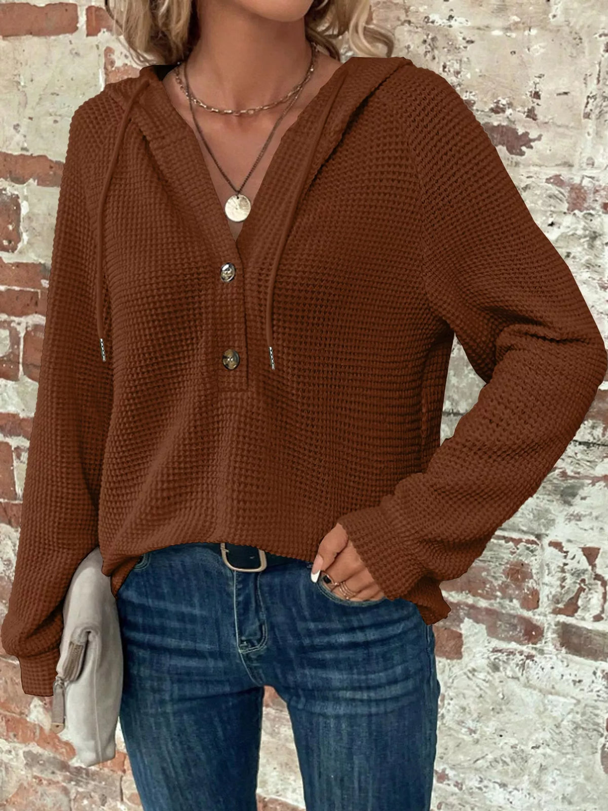 Brown waffle-knit button hoodie on model with hooded neckline and button front