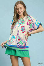 Cream border print puff sleeve blouse with multicolor floral motifs