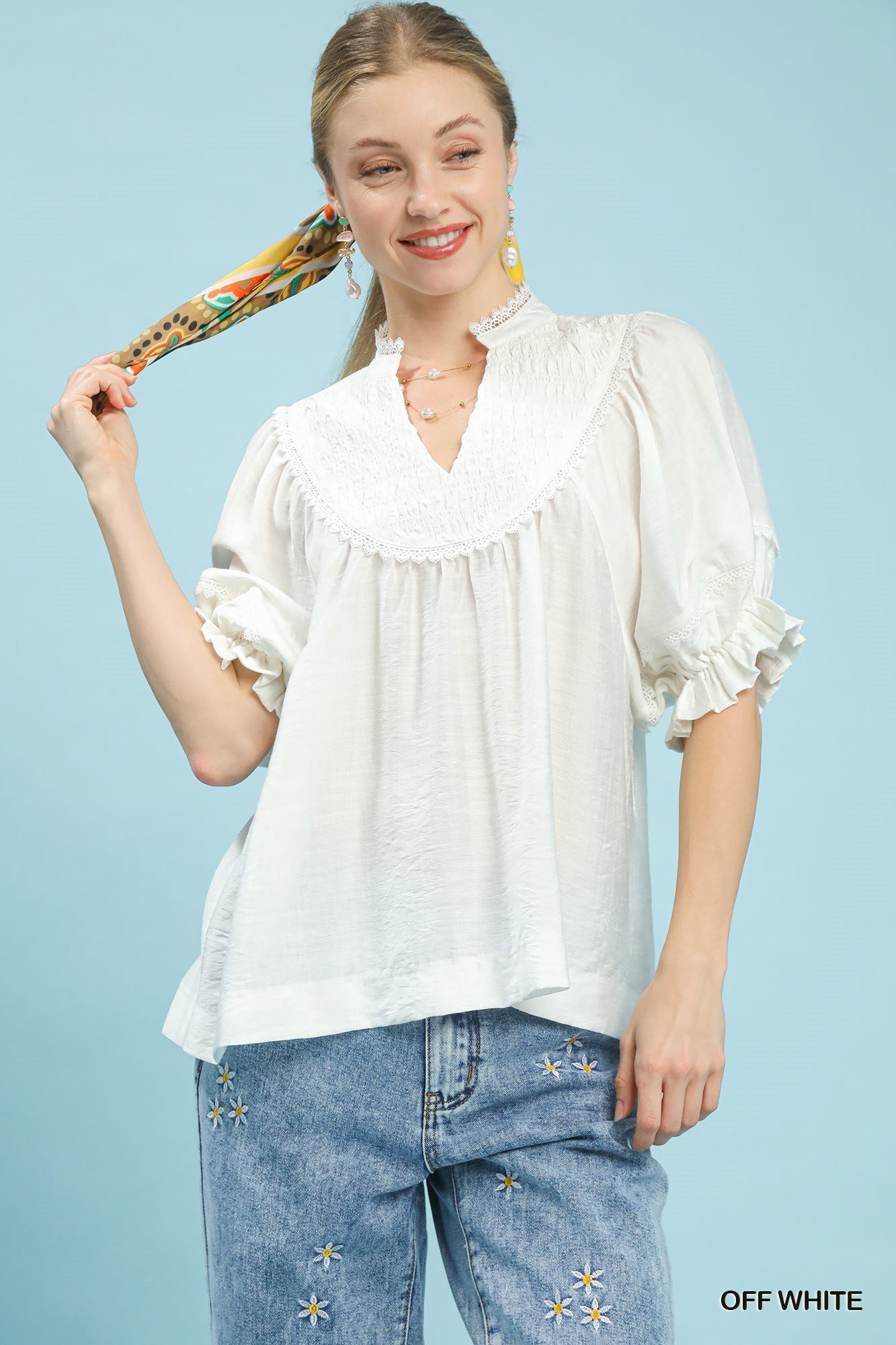 Off-white smocked yoke blouse with ruffle sleeves and V-neck, womens top