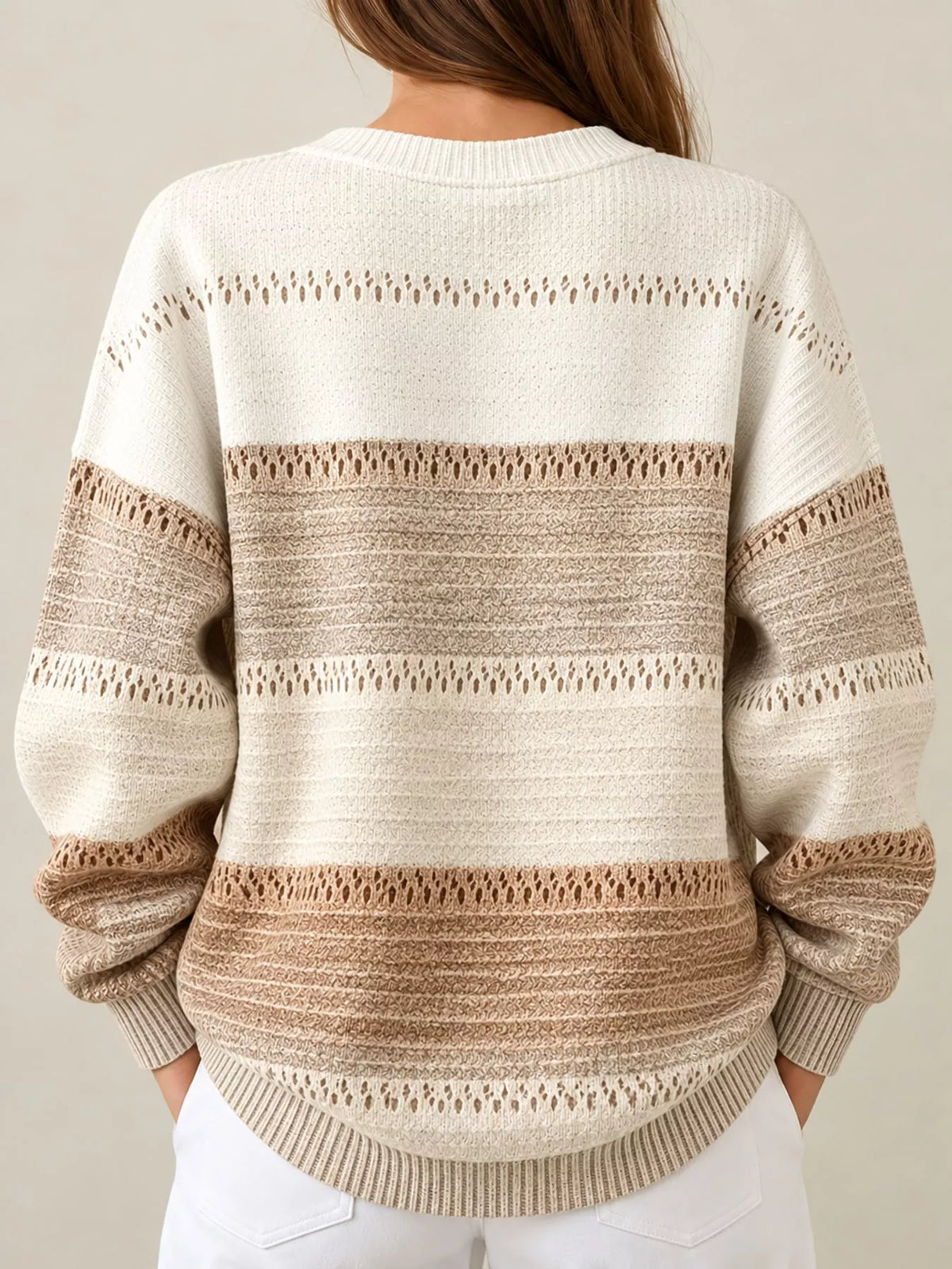 Back view of tan and cream color-block knit henley sweatshirt, long sleeves