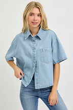 Light blue denim cropped half-sleeve shirt with button front and chest pocket