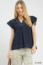 Dark denim cap-sleeve top with V-neck and stitched yoke seams