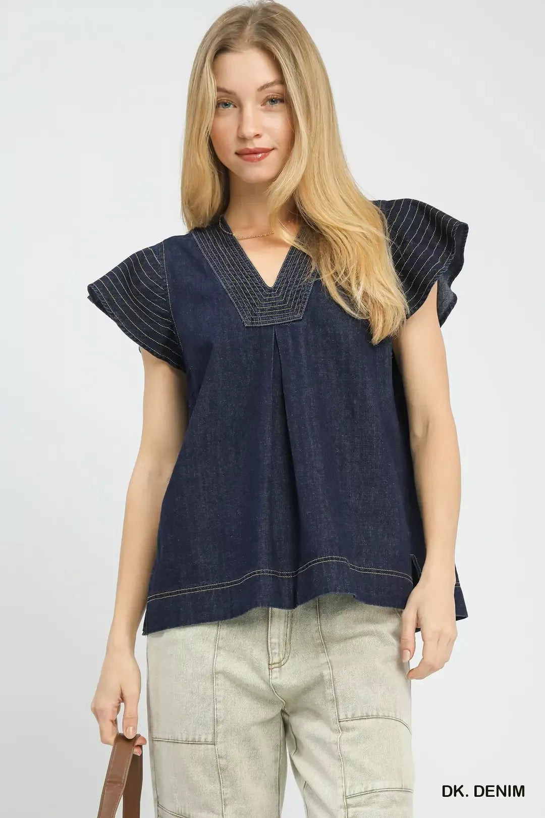 Dark denim cap-sleeve top with V-neck and stitched yoke seams
