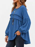 Blue frayed-trim peplum blouse with ruffle yoke and long puff sleeves, side view