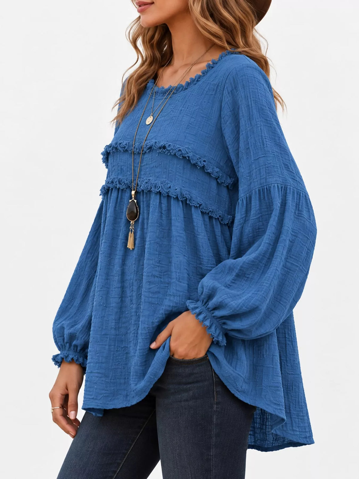 Blue frayed-trim peplum blouse with ruffle yoke and long puff sleeves, side view