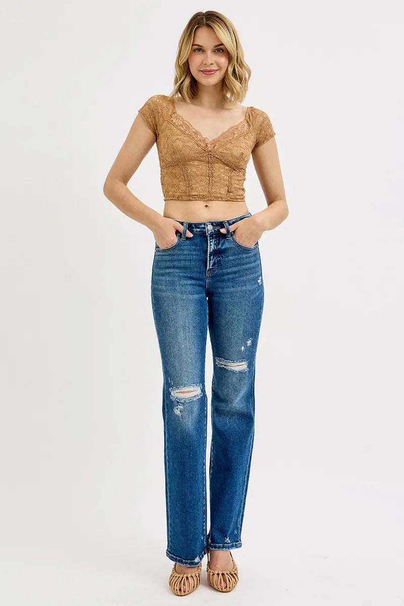 Women's high-rise straight-leg jeans with ripped knees and distressed hems, dark blue denim.