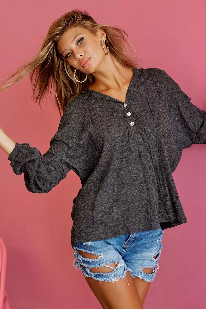 Charcoal textured knit hoodie with hood, buttoned placket and long sleeves